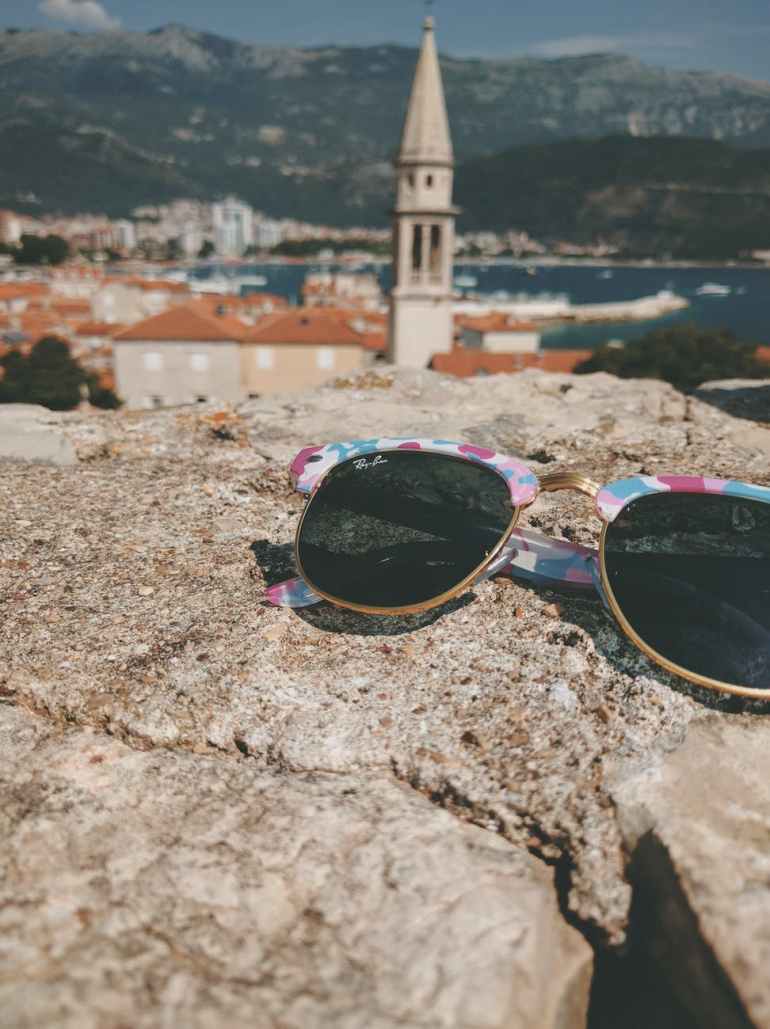 sunglasses on stones